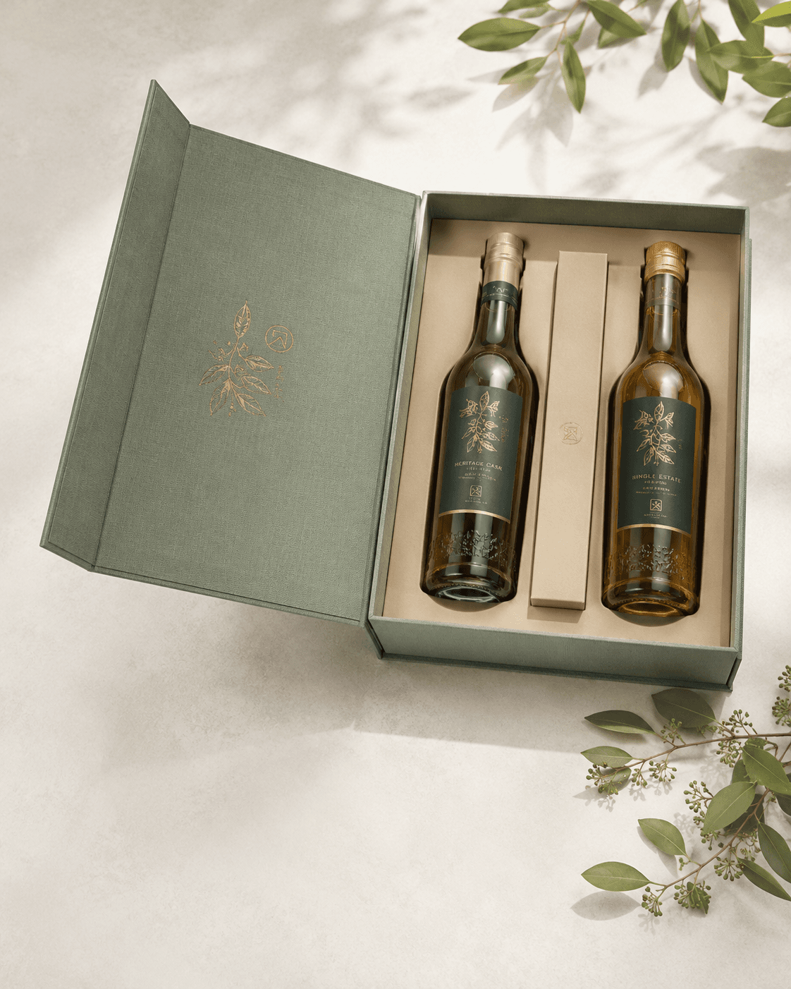 Twin-bottle presentation case for a boutique spirits label, linen-wrapped