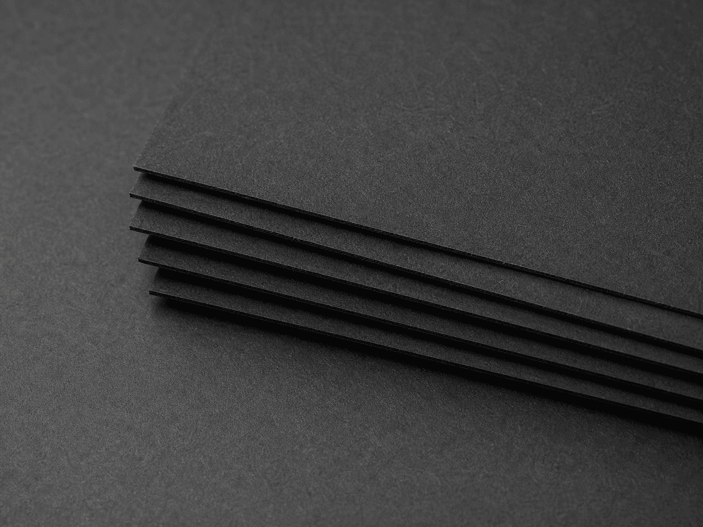 Macro photo of black-core paperboard with black-through cut edges
